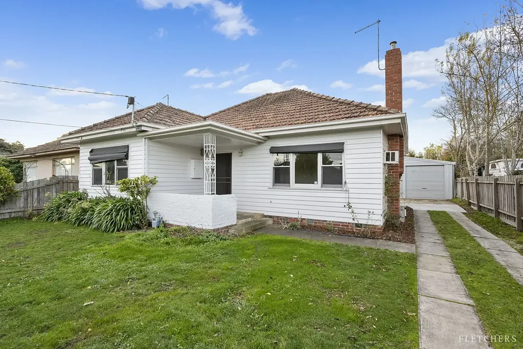 CENTRALLY HEATED HOME WITH FOUR CAR GARAGE