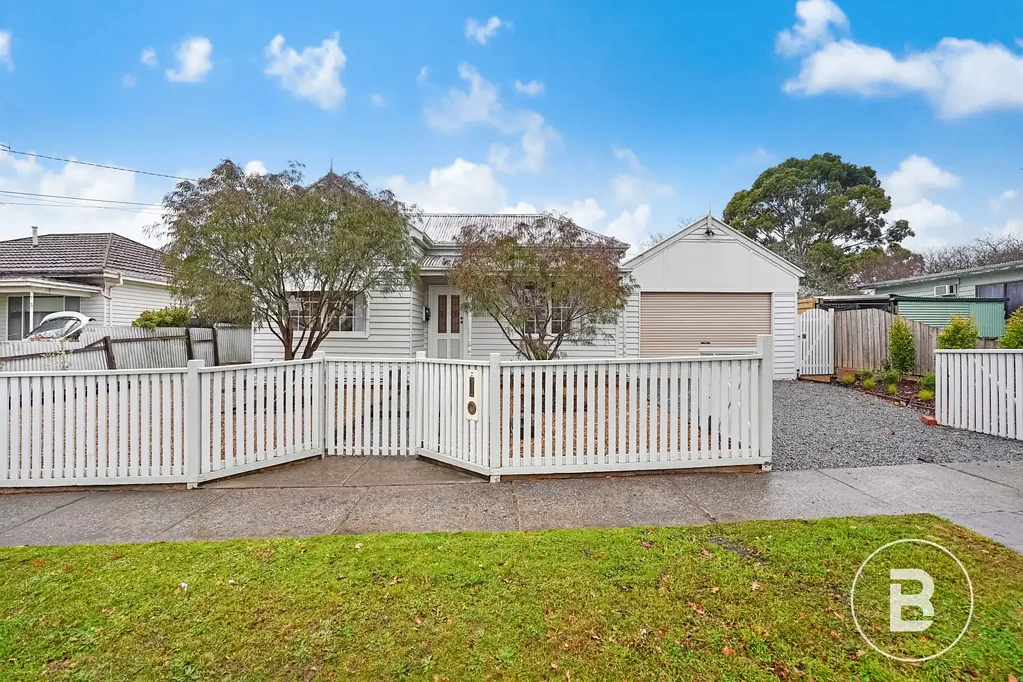 CHARMING THREE-BEDROOM, TWO BATHROOM HOME IN GREAT LOCATION