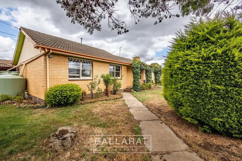 RENOVATED THREE-BEDROOM BRICK WITH EXTENSIVE SHEDDING
