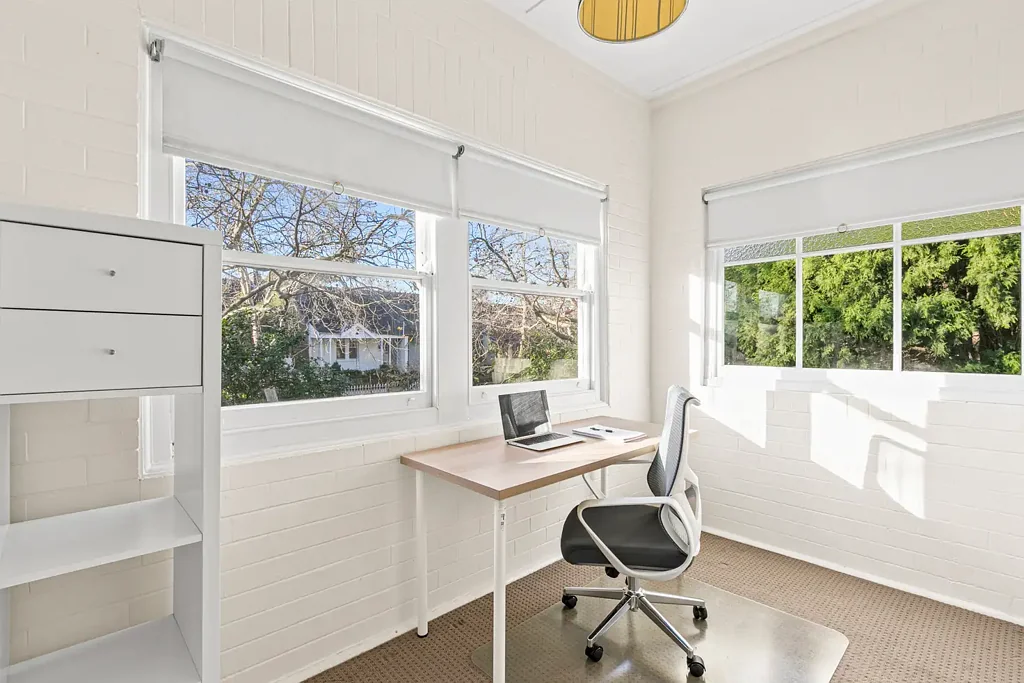 Spacious two bedroom apartment with sunroom, and massive, private, grassed courtyard