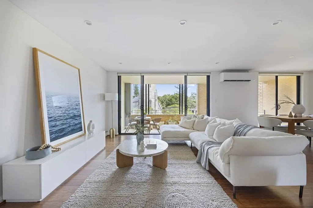 Sunlit Top-Floor Retreat with Ocean Views & Prime Village Location