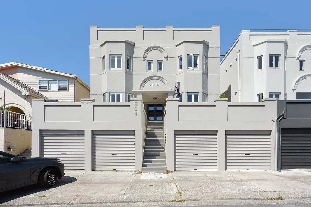 The Perfect Beach Pad In a Breathtaking Ben Buckler Setting with Lock Up Garage + Parking on Driveway