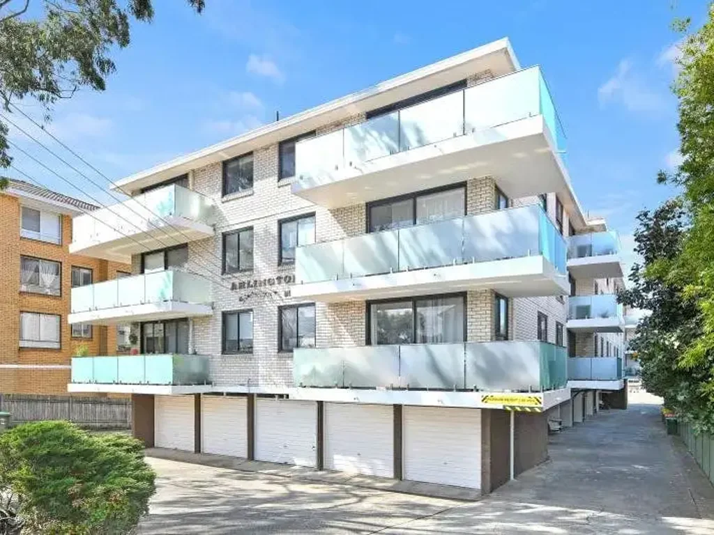 MODERN TWO BEDROOM UNIT WITH NEW CARPET, NEW PAINT, BALCONY, POOL AND PARKING