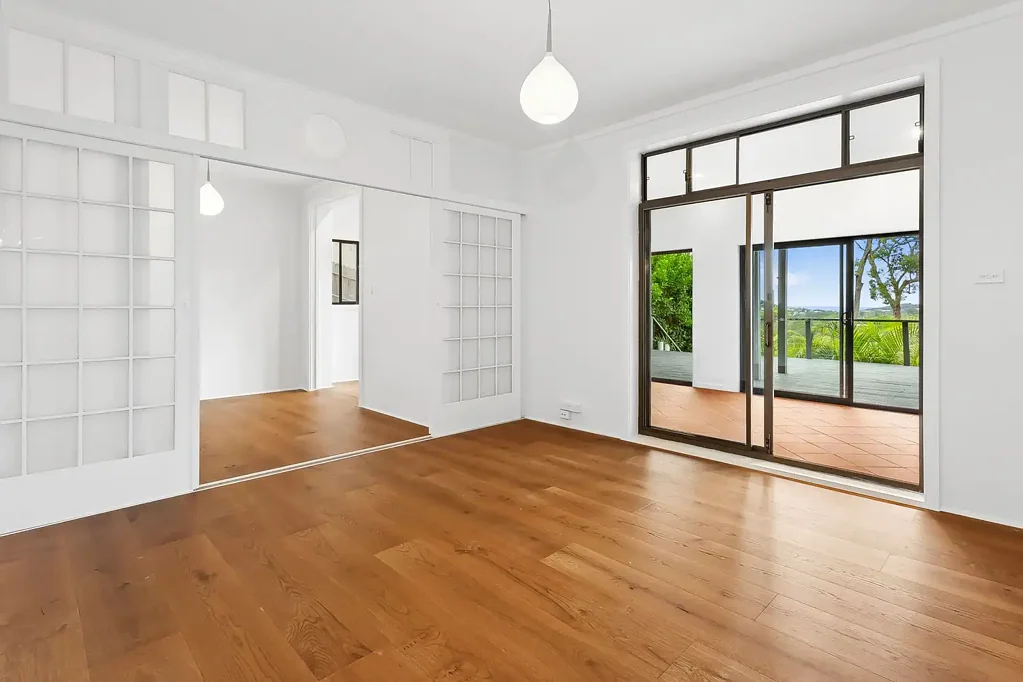 Coastal-Inspired Lower Duplex Home with Ocean Views and Exceptional Entertaining Space