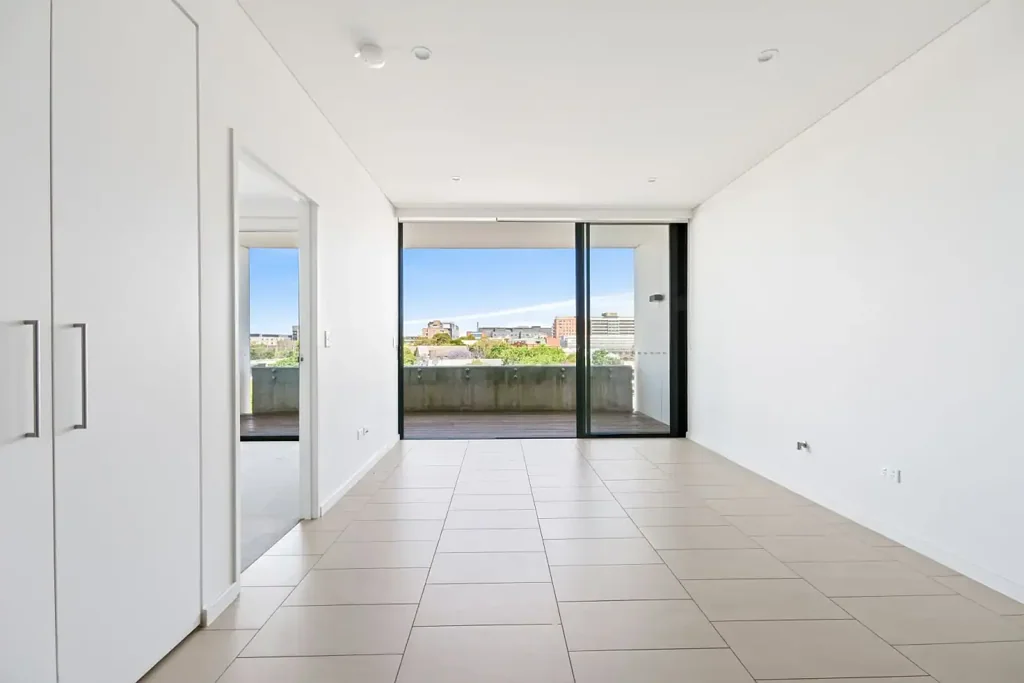 Unfurnished one bedroom apartment with enclosed study room + secure parking