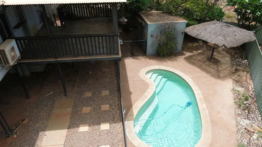 Aviation style home with in ground pool and large grounds.