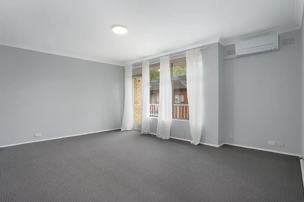 Top Floor Apartment with Aircon & Carport