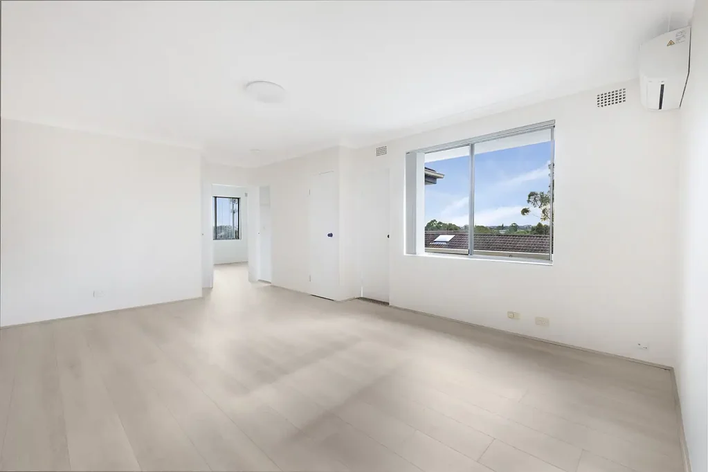 Renovated top-floor apartment with district views