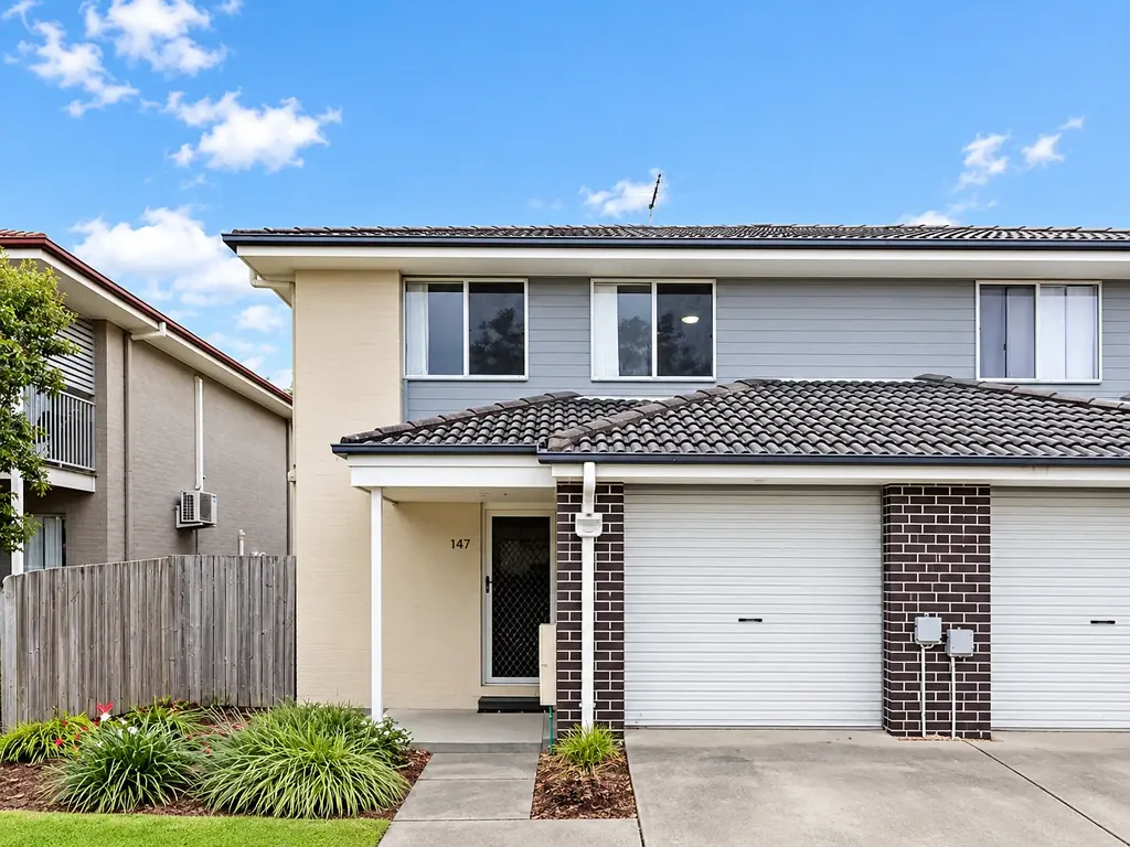 Freshly Painted Two-Storey Townhouse with Covered Patio