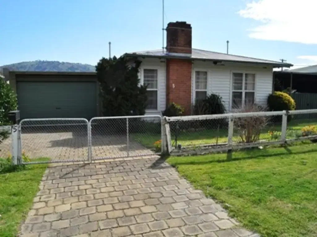 Three bedroom weatherboard home, open plan living, double lock up carport, large enclosed back yard.