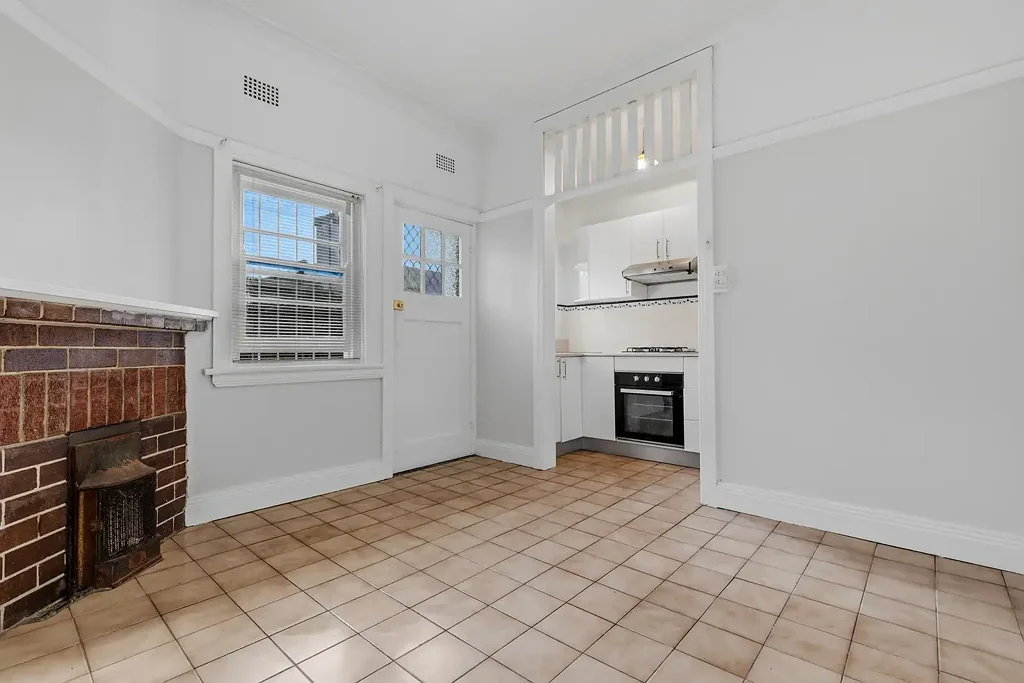 Freshly Painted Two-Bedroom Apartment with Sunroom in Prime Location