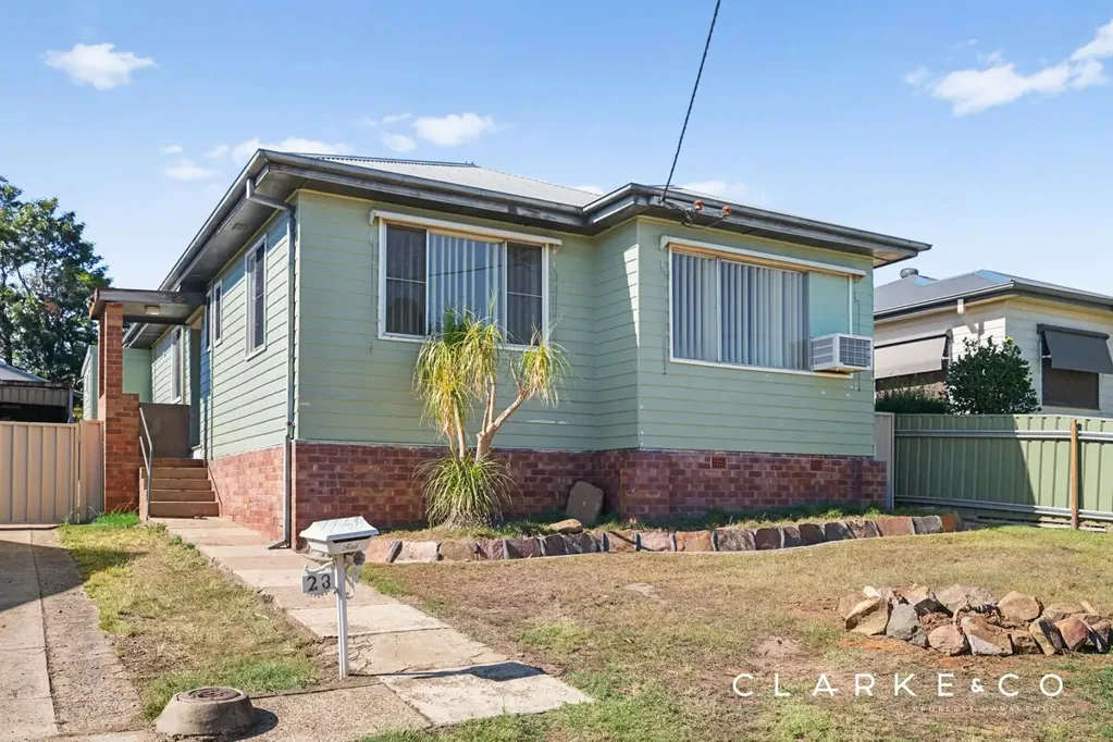UPDATED FAMILY HOME WITH LARGE YARD & ENTERTAINING DECK!