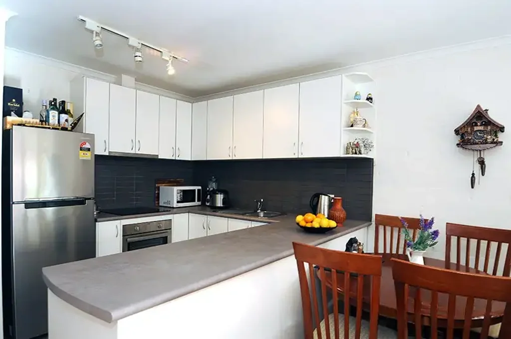 Immaculately maintained split level unit will impress!