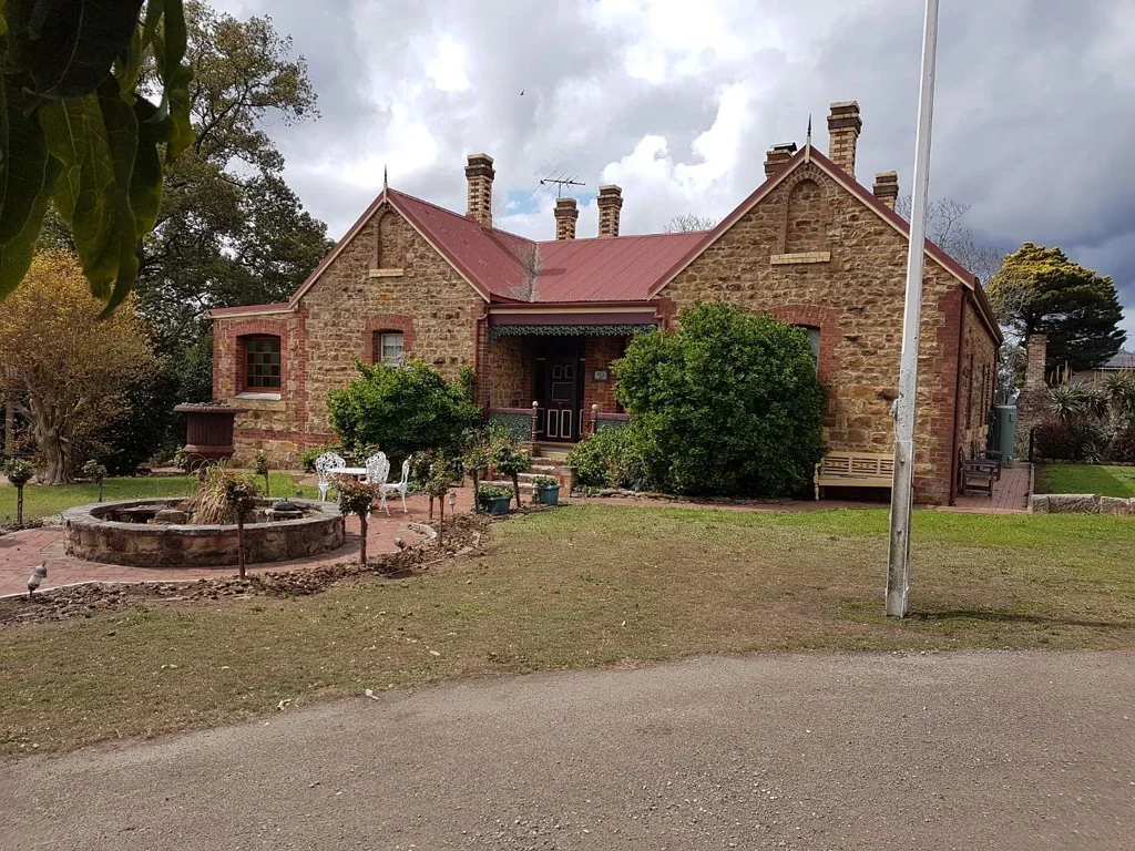 Studio sized rooms for rent in heritage Sandstone House on 2500sq metres
