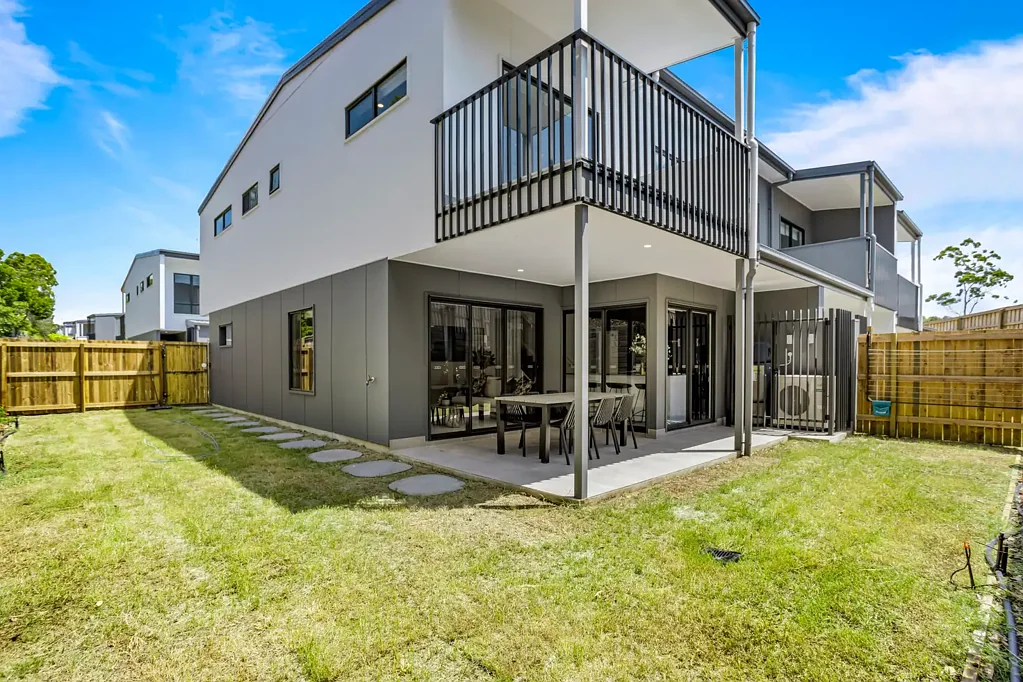 Oversized Courtyard in Prime McDowall Location! A Rare Find in Townhome Living!