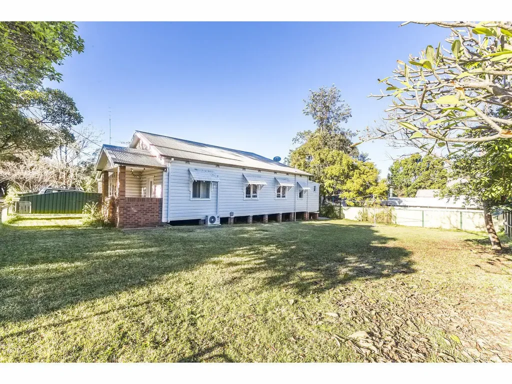 CHARMING CHARACTER HOME ON A HUGE BLOCK WITH OFF-STREET PARKING
