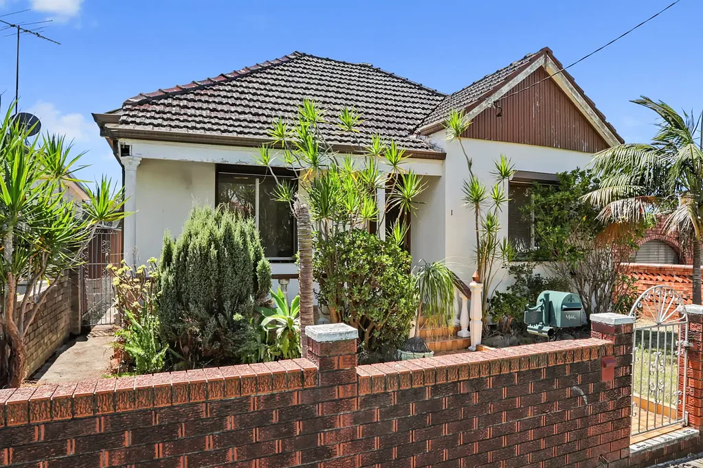 Three Bedroom Home with Rear Lane Access in Prime Location