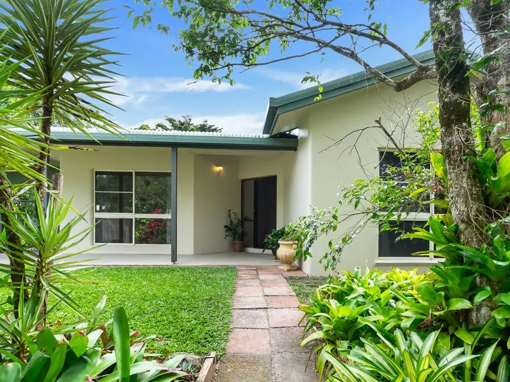 Nestled amongst lush tropical gardens, this spacious five-bedroom family home offers the perfect combination of comfort, space, and privacy.