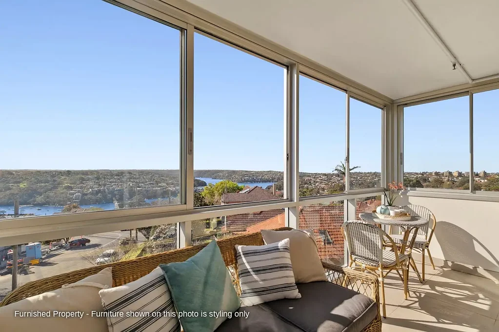 Partly furnished north-facing one-bedroom with 180-degree Middle Harbour views, sunroom and secure tandem parking.