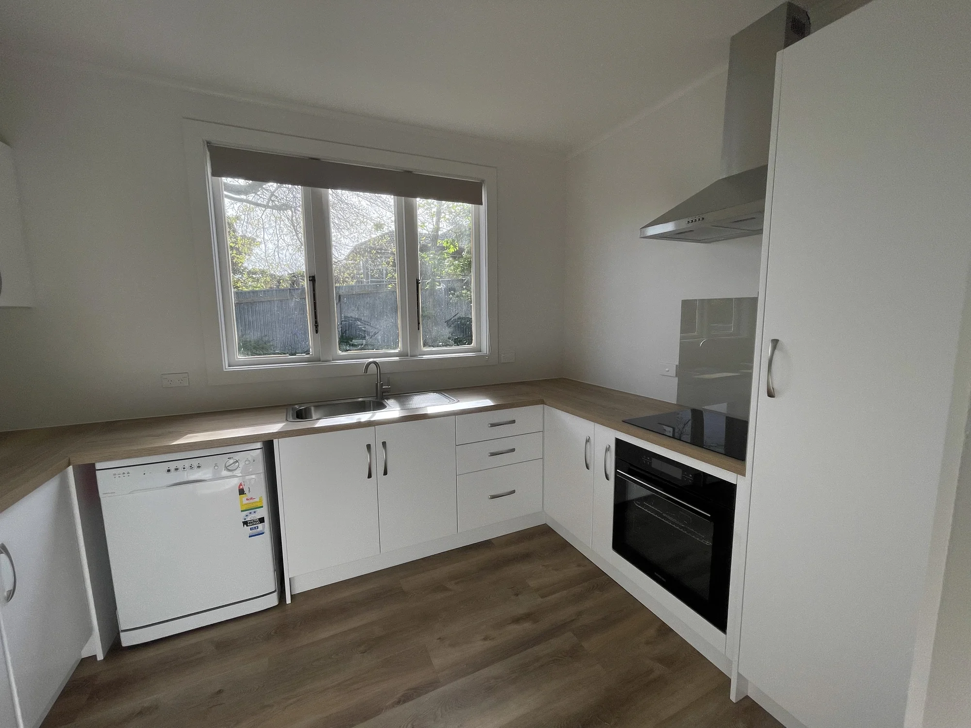 Sunny Renovated Home with no Lawns to Mow!