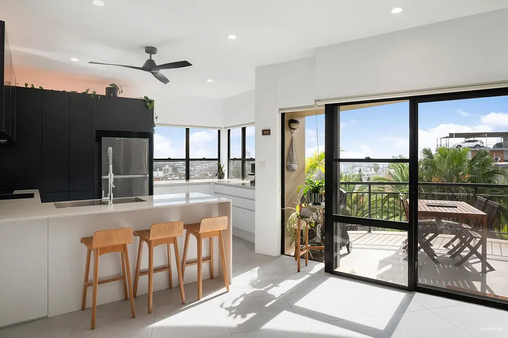 STUNNING RENOVATED APARTMENT WITH CITY & WATER VIEWS, HOME OFFICE & OVERSIZED GARAGE