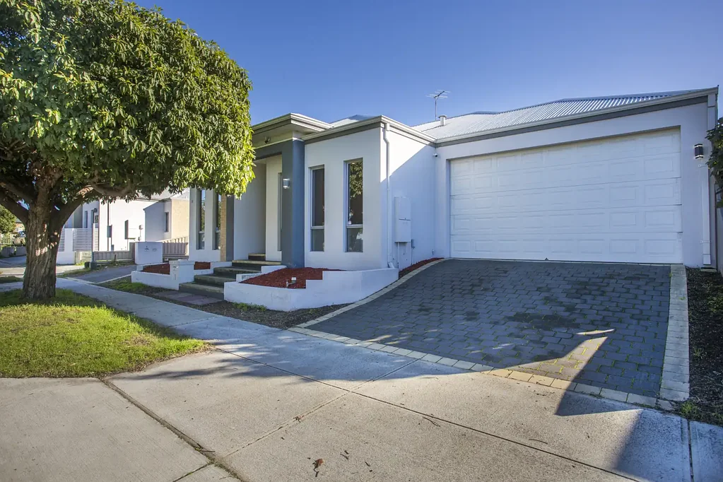 Modern front home in small group of three.