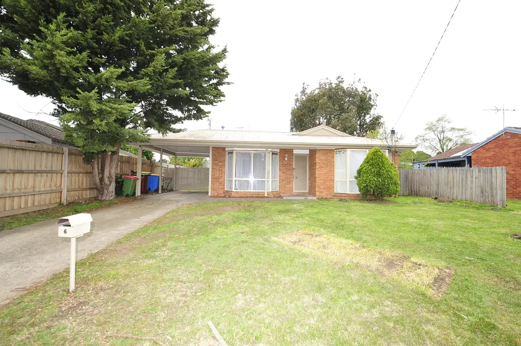 Freshly Painted with New Floors - Family Home with Extra Potential!