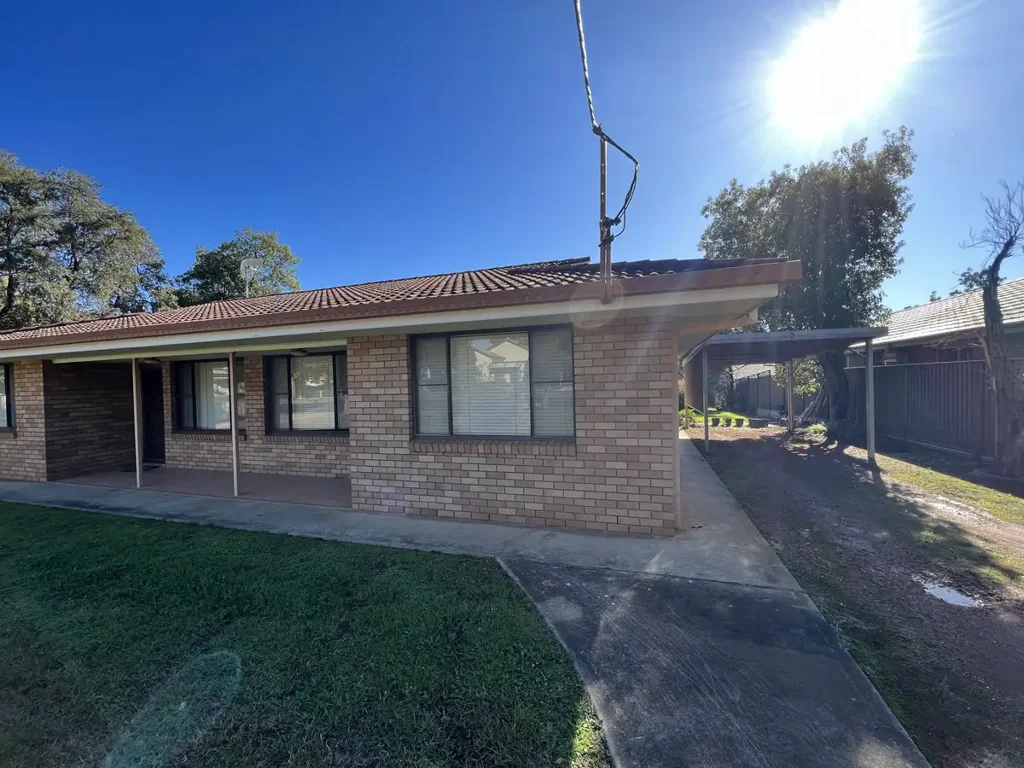 TWO BEDROOM BRICK UNIT WITH CARPORT