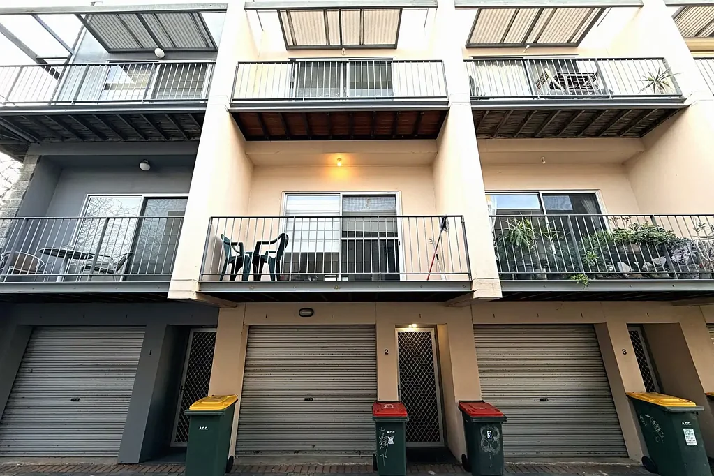 Spacious City Townhouse Offering Flexible Living and Secure Parking