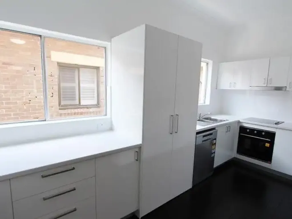 RENOVATED THREE BEDROOM APARTMENT WITH TWO BATHROOMS & FLOORBOARDS.