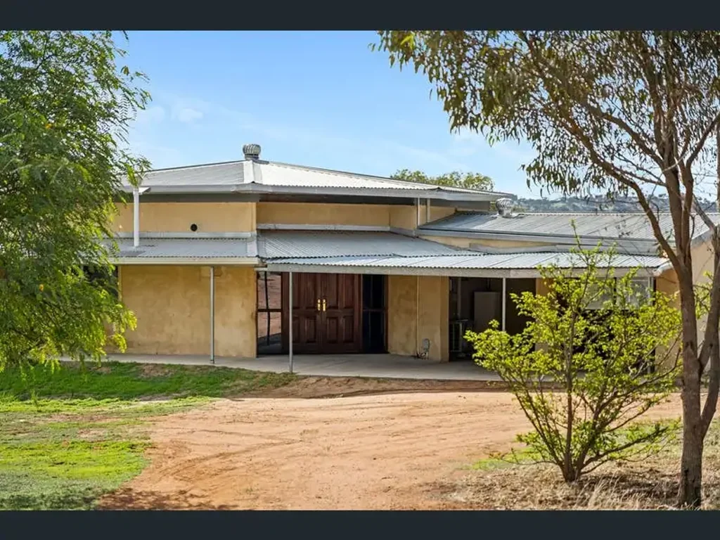 Spacious House on a Large Block with Sheds