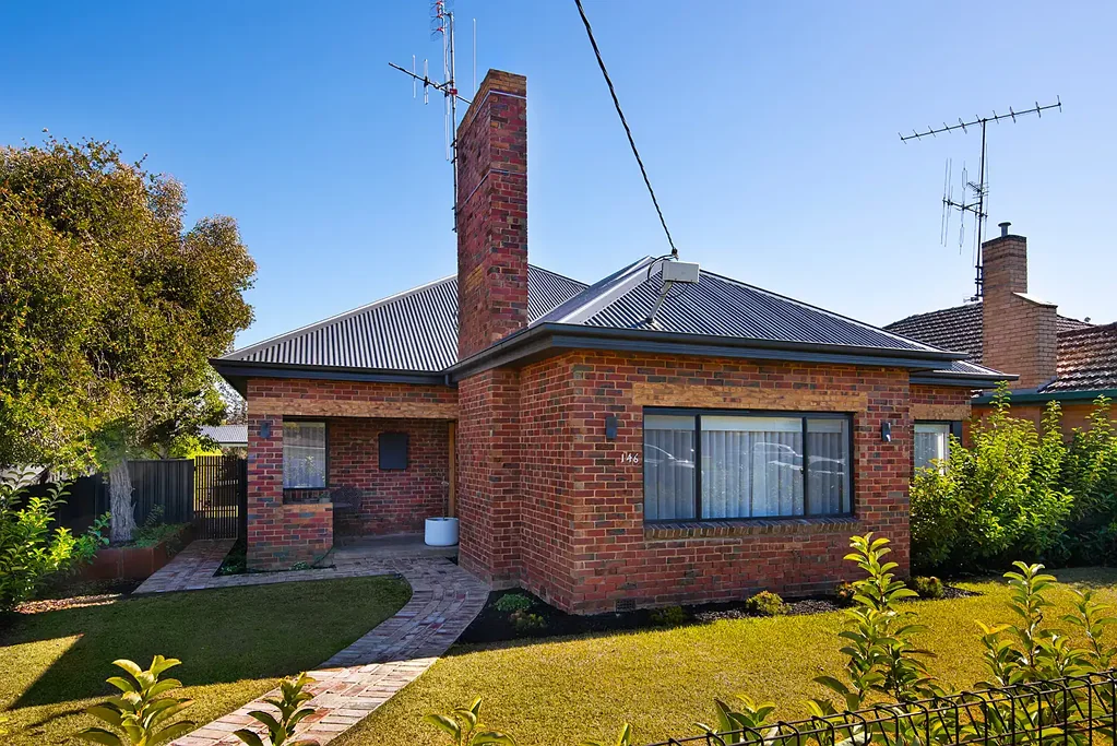 Flora Hill 3 Bedroom Stunningly renovated Mid-Century brick home in a prime Flora Hill locale.