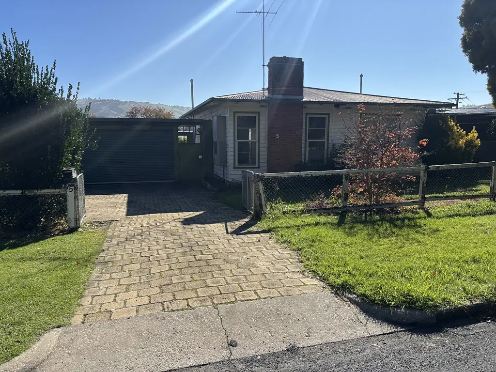 Three bedroom weatherboard home, open plan living, double lock up carport, large enclosed back yard.