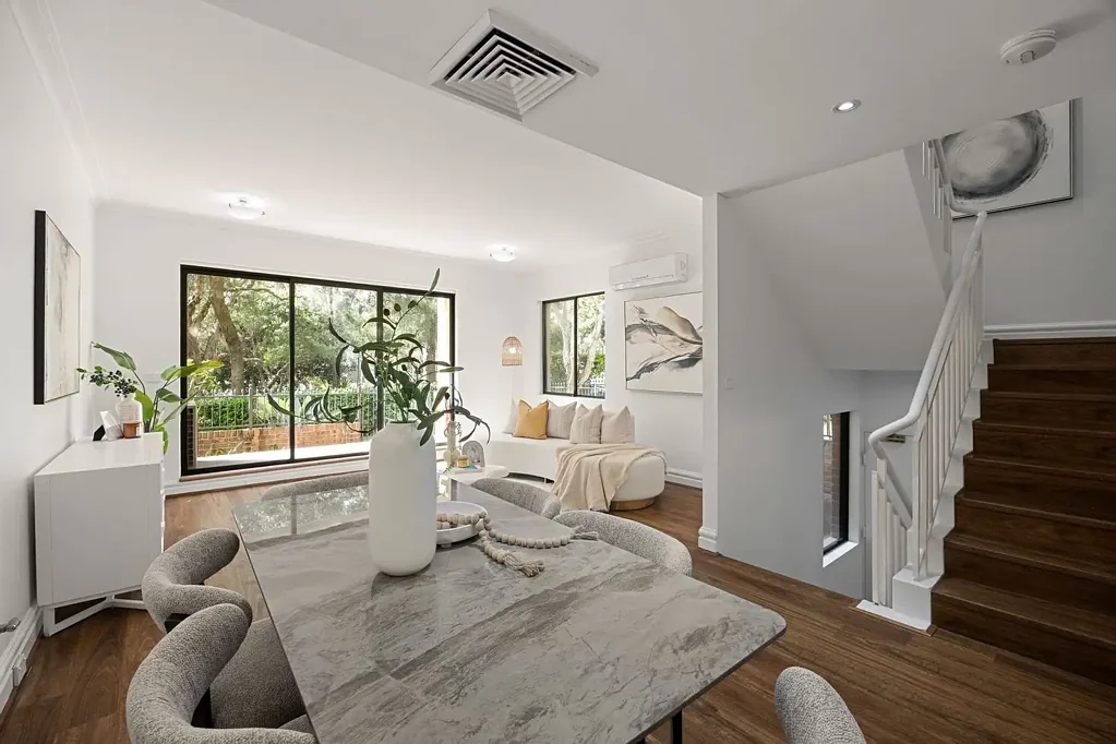 Elegant double brick townhouse welcomes elevated bay and park views on the waterside