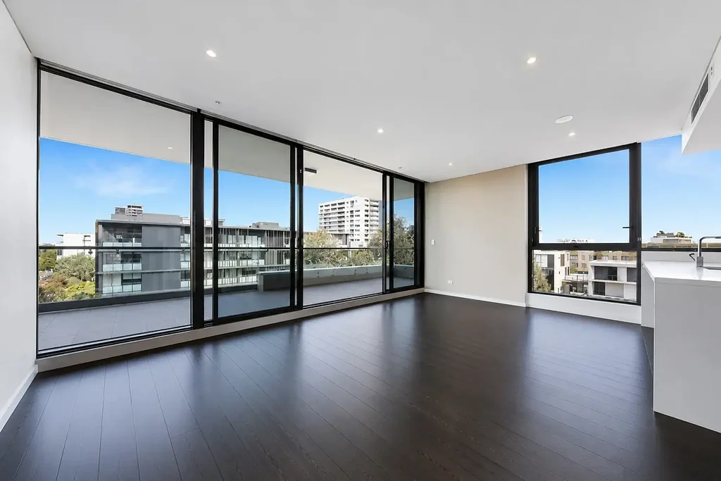 Stylish Two-Bedroom Apartment with Luxe Dark Timber Floors, Parking & Oversized Balcony in Prime Zetland Location