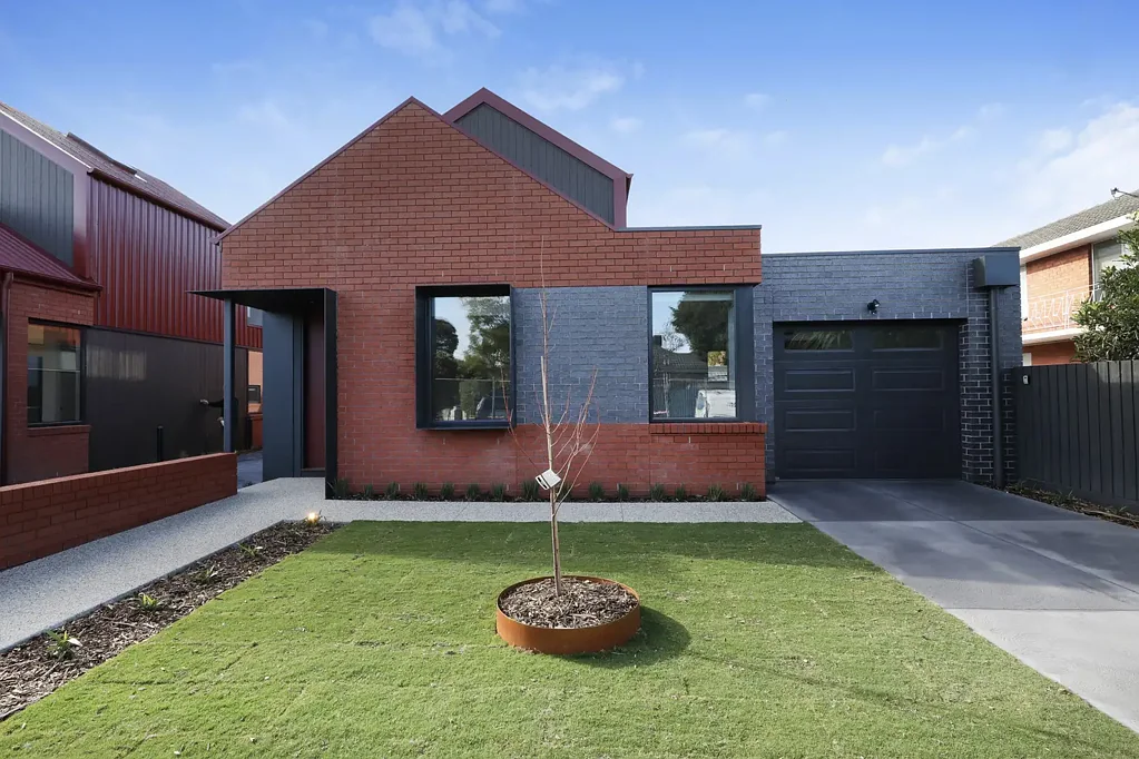 STREET-FRONT LUXURY WITH PRIVATE DRIVEWAY & BUTLER'S PANTRY!