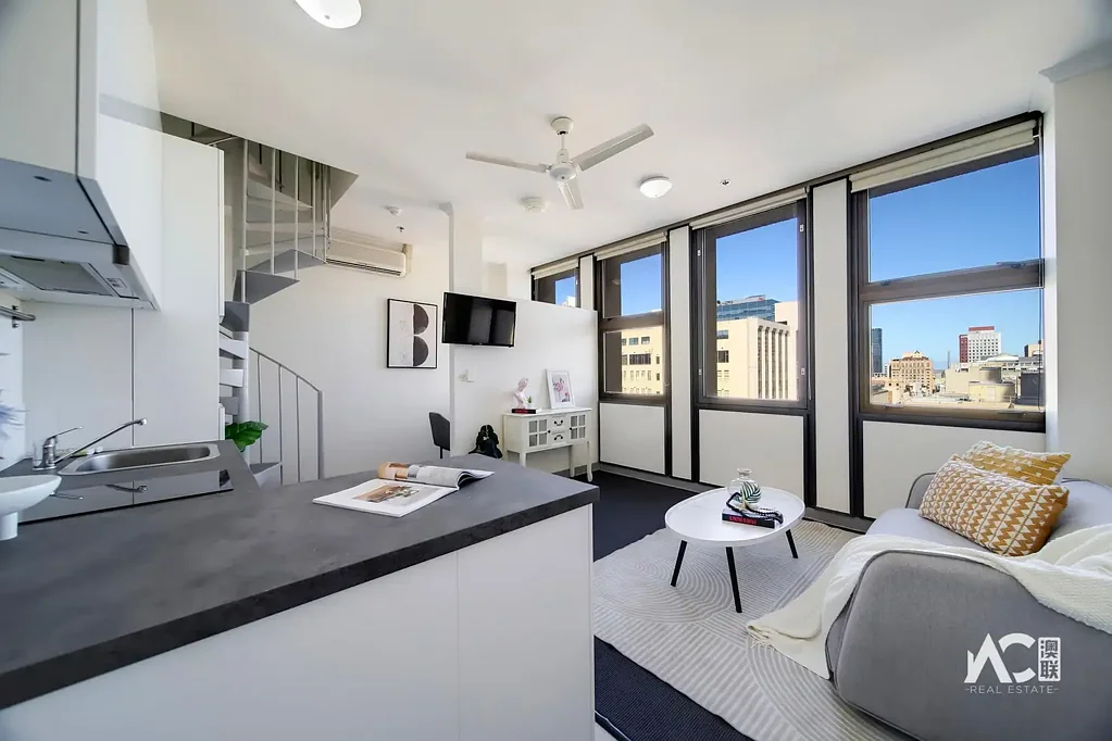Stylish Two-Level Apartment with Balcony & Study Nook