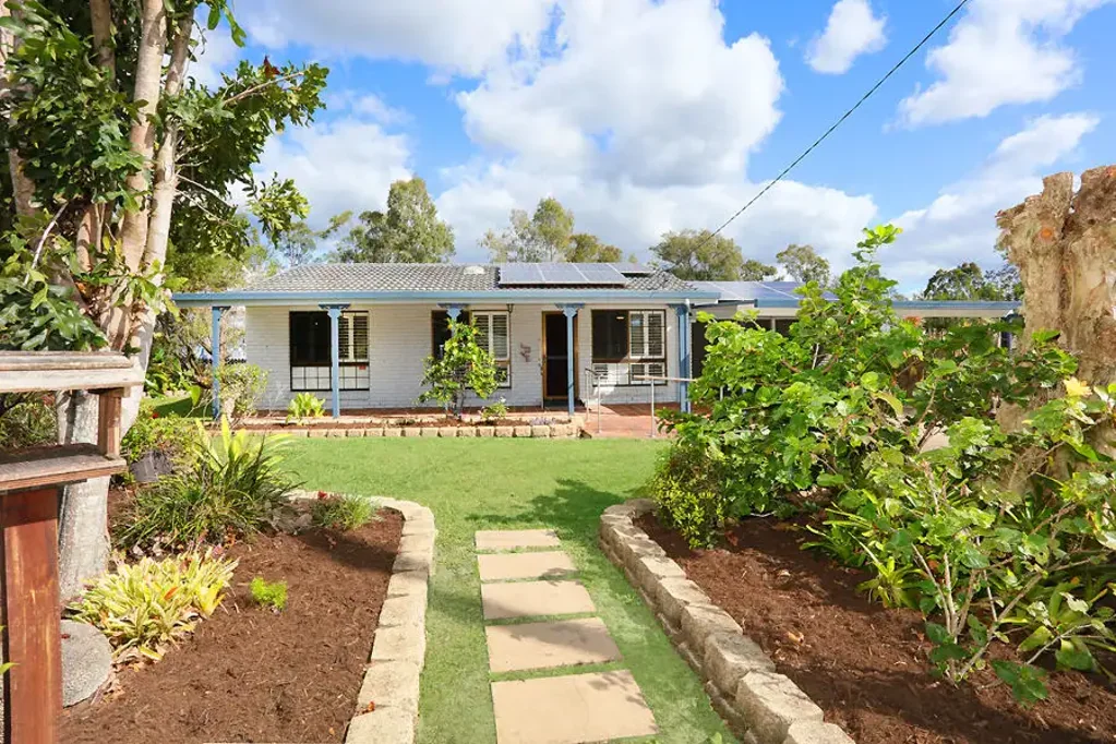 Elegant Home with Cottage Charm and Stunning Gardens
