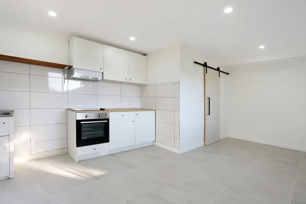 Self Contained studio with ample storage and large yard.