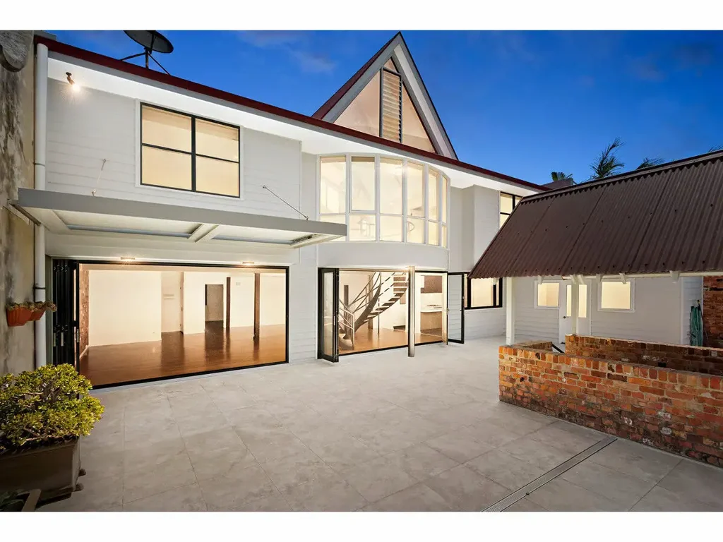 RARE MULTI-LEVEL RESIDENCE WITH SEVEN BEDROOMS IN PREMIUM BEACHSIDE LOCATION