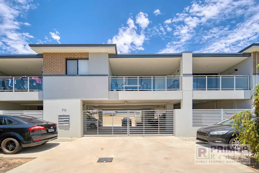 UNFURNISHED modern first-floor apartment with secure parking.