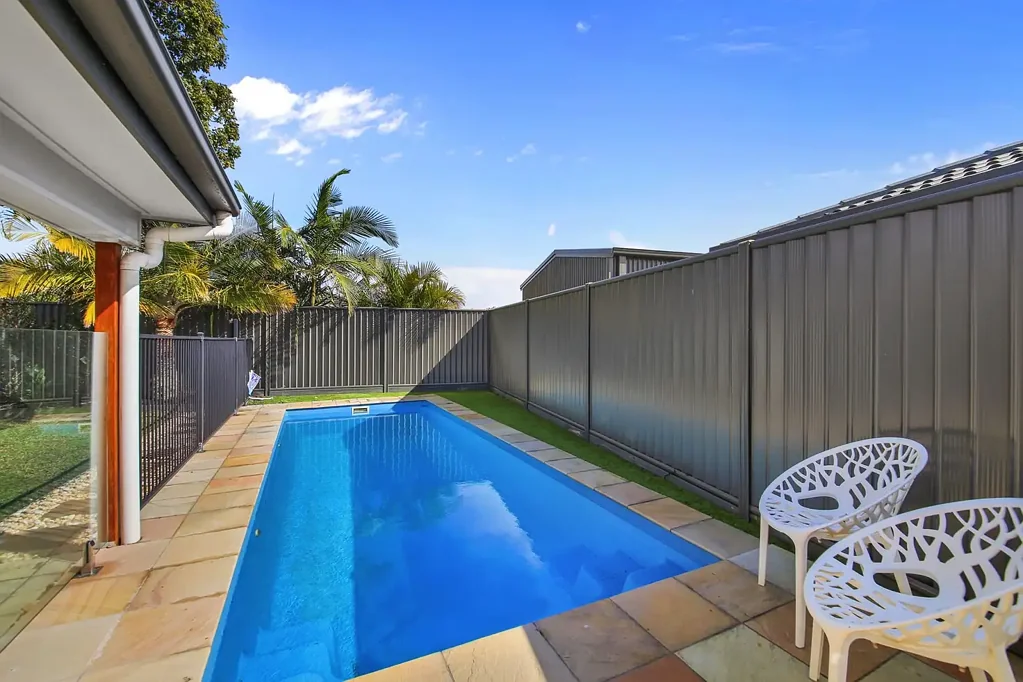 Four bedroom home with inground pool in sought after location.