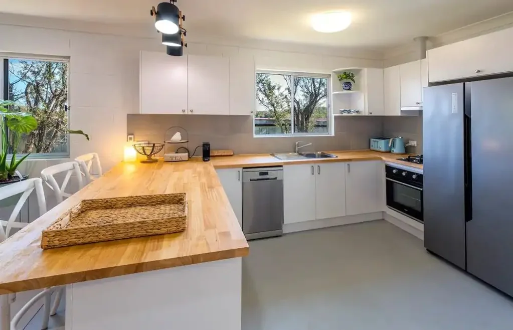 Walk to Boambee Bay Reserve from this furnished cottage!