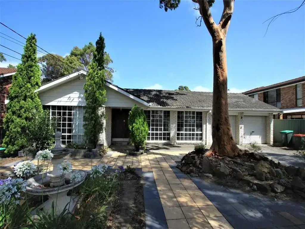 Charming Single-Level Home with Sunlit Interiors and Leafy Garden Retreat