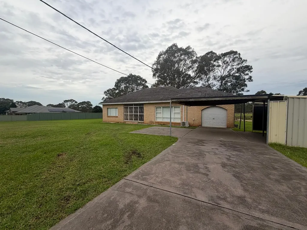 Freshly Updated Acreage Living on 5 Private Acres