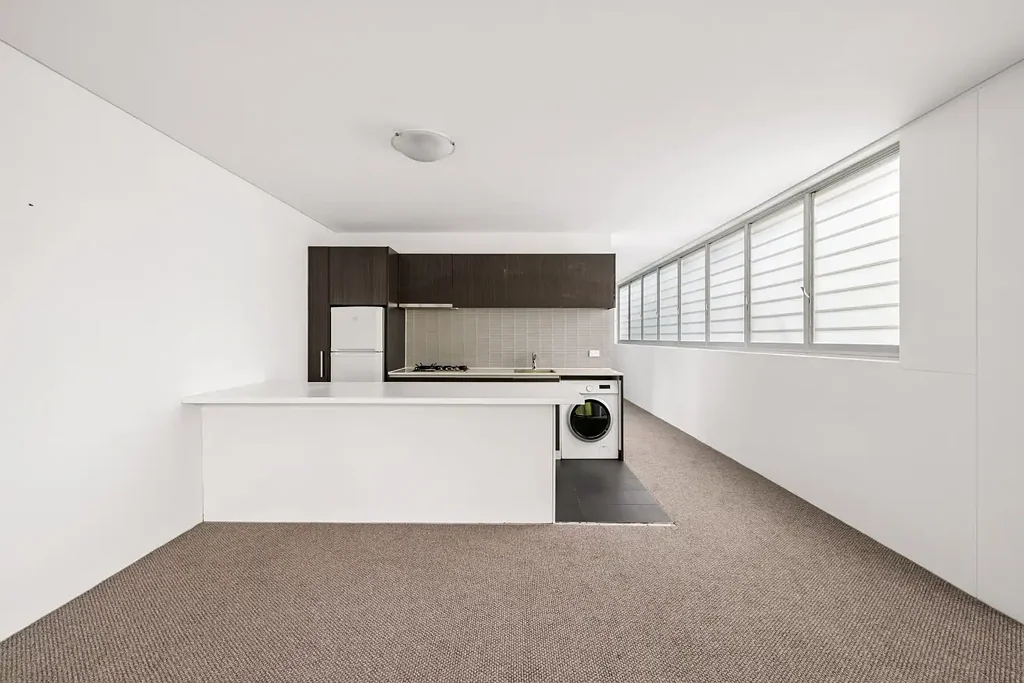 House-like scale / prized rear outlook / dual balconies and parking – Vespa building