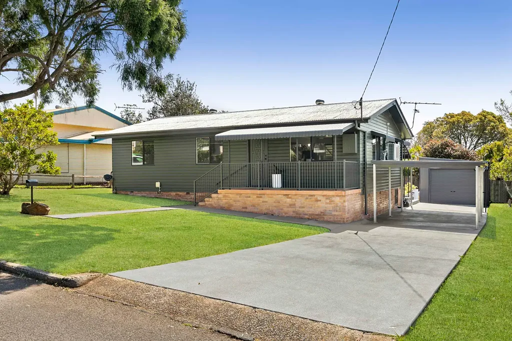Desirable Timber Home with Garage + Carport!