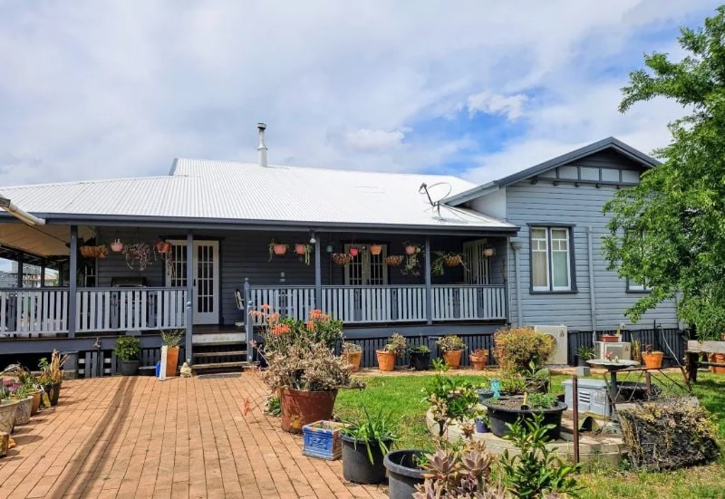 Cambooya  3.5 acres of fertile soil, 2 homes , 6 sheds, solar system, and bore