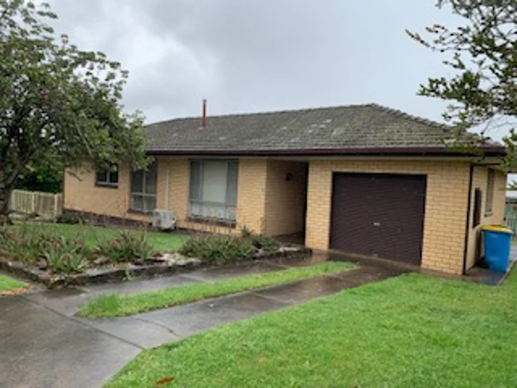 Compact Brick and tile house located in quiet residential Street