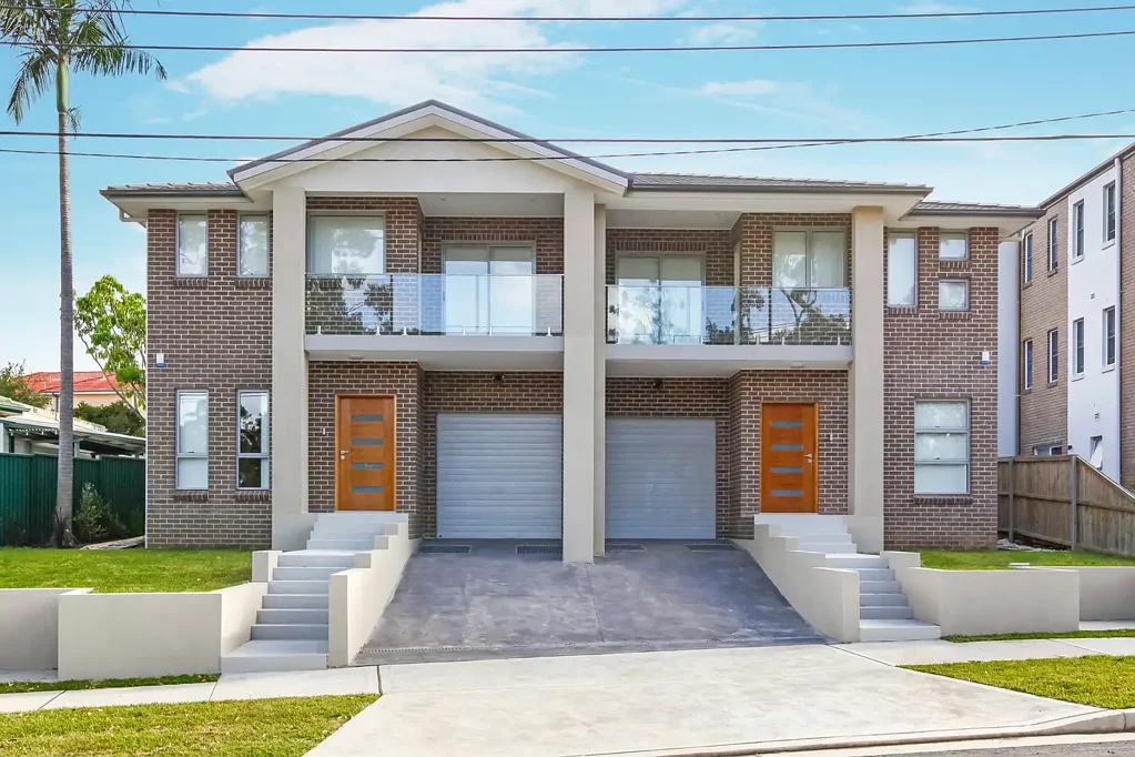 Five-bedroom duplex designed for the extended family in mind with two master bedrooms with ensuites, indoor and outdoor kitchens!!
